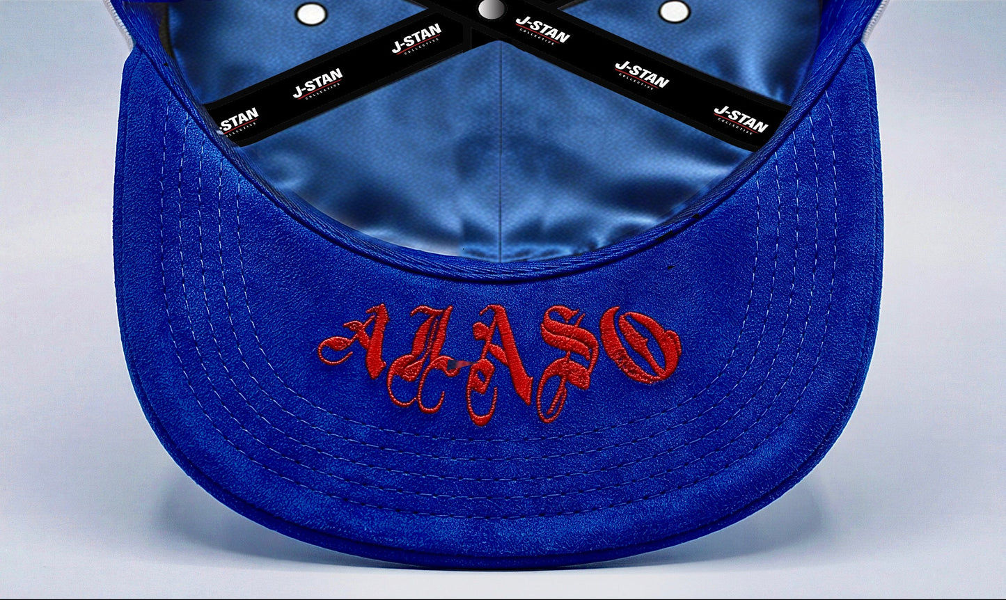 White and blue cap with various designs and text on a light gray background
